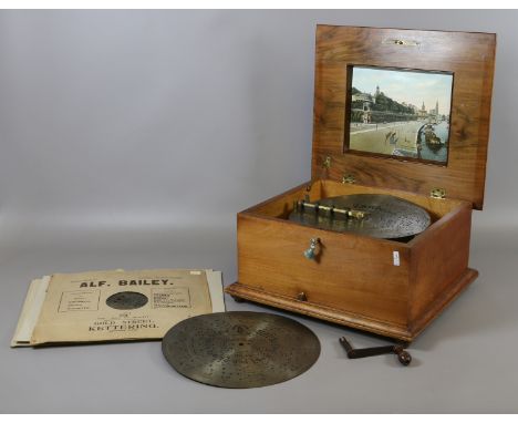 A C19th Swiss walnut cased polyphon disc playing music box with marquetry inlay and 5 discs. Discs 28cm. Condition Report. To