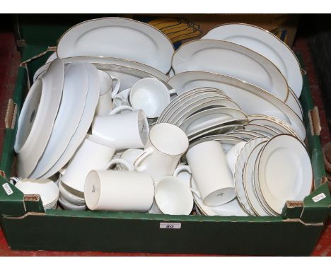 A boxed collection of white ceramic tea and dinner wares with gilt edge, by various makers