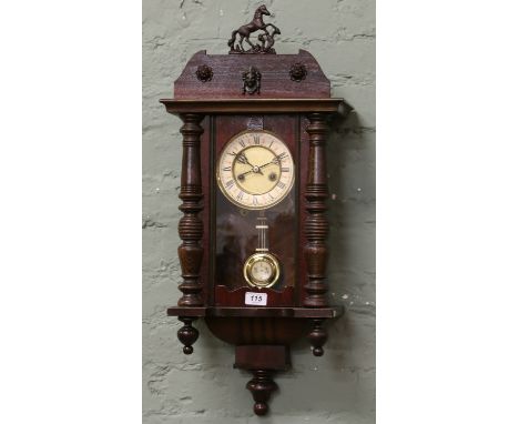 An early C20th German eight day small Vienna clock