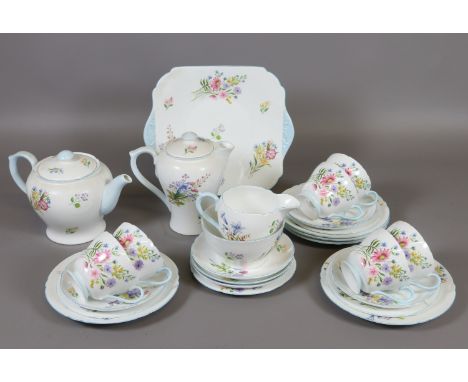 A Shelley twenty six piece tea service decorated in the wild flowers design and numbered 13668. Condition Report. To be used 