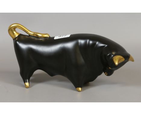 A Beswick Trentham Art pottery stylized model of a bull designed by Colin Mebourne. Ground in matt black and with gilt highli