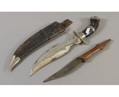 A Guerka Kukri knife in wooden scabbard and similar dagger.