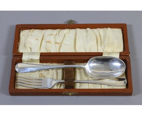 A cased silver christening set, fork and spoon by C. W. Fletcher & Son Ltd, assayed Sheffield 1945, 46 grams.