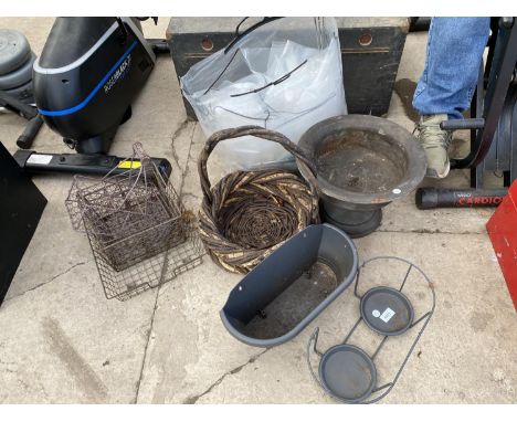AN ASSORTMENT OF ITEMS TO INCLUDE A METAL PLANTER AND A WICKER BASKET ETC 