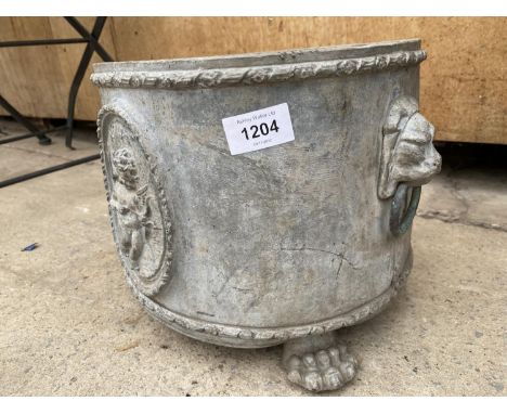A VICTORIAN HEAVY LEAD PLANTER WITH CHERUB DESIGN AND LION PAW FEET (H:23CM D:29CM) 