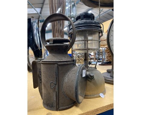 A VINTAGE TILLEY LAMP AND A VINTAGE RAILWAY LAMP 