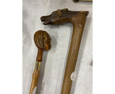 TWO COLLECTABLE ITEMS - SHOE HORN WITH GIRL'S HEAD AND WALKING STICK WITH HORSE HEAD TOP 