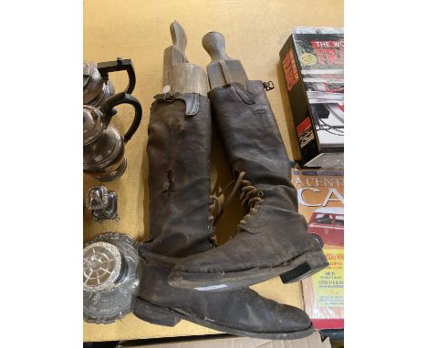 A PAIR OF VINTAGE LEATHER RIDING BOOTS WITH FRONT LACES AND WOODEN BOOT SHAPERS 