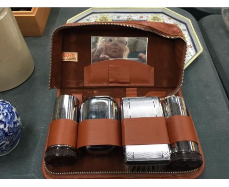 A CASED VINTAGE GENTLEMAN'S GROOMING KIT 