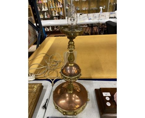 AN UNUSUAL VINTAGE BRASS AND COPPER LAMP BASE 