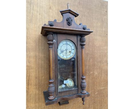 A VINTAGE VIENNA STYLE OAK WALL CLOCK COMPLETE WITH PENDULUM 