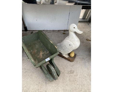 A WOODEN DUCK FIGURE AND A FURTHER SMALL WOODEN WHEEL BARROW PLANTER 