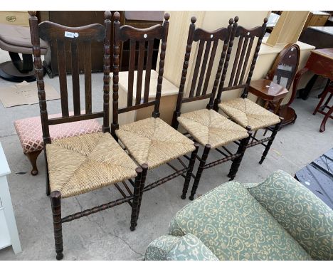 A SET OF FOUR OAK JACOBEAN STYLE RUSH SEATED DINING CHAIRS WITH BOBBIN TURNINGS 