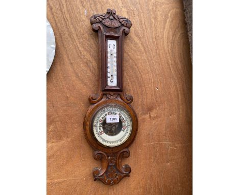 A VINTAGE OAK CASED WALL HANGING BAROMETER 