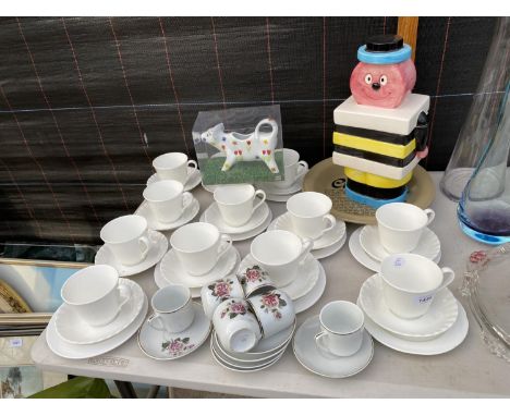 AN ASSORTMENT OF CERAMIC ITEMS TO INCLUDE TRIOS AND A BERTIE BASSETT JAR ETC 