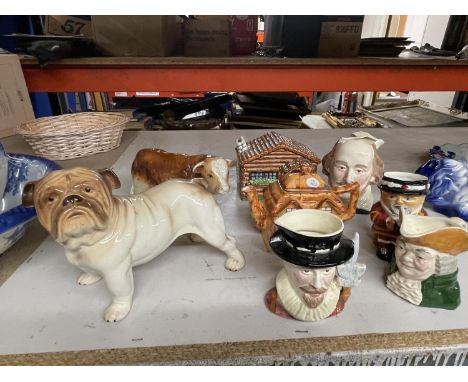 A MIXED LOT TO INCLUDE STAFFORDSHIRE CHARACTER JUGS, CERAMIC COTTAGES, BULLDOG AND BULL 