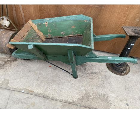 A LARGE WOODEN WHELL BARROW GARDEN PLANTER 