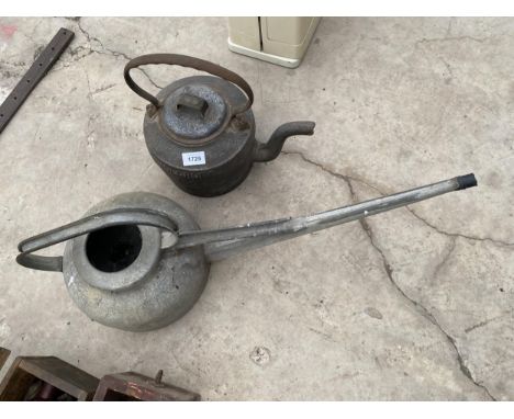 A VINTAGE GALVANISED WATERING CAN AND A HEAVY CAST IRON HOLCROFT &amp; SONS KETTLE 