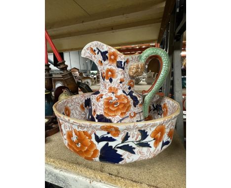 AN IRONSTONE CHINA JUG AND WASH BASIN 