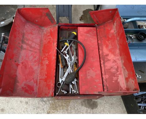 A RED METAL TOOL BOX WITH AN ASSORTMENT OF TOOLS TO INCLUDE SPANNERS AND SCREW DRIVERS ETC 