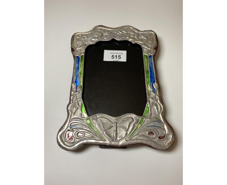 AN ART NOUVEAU STYLE SILVER PHOTO FRAME WITH ENAMEL DESIGN 