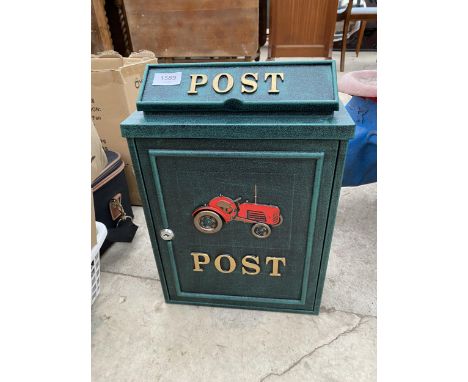 A METAL POST BOX DEPICTING A TRACTOR TO INCLUDE TWO KEYS 