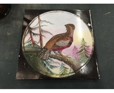 A VINTAGE CERAMIC TILE WITH AN IMAGE OF A PHEASANT 