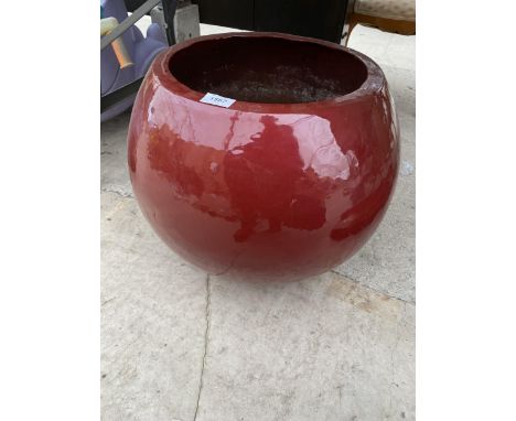A MODERN FIBRE GLASS SHEPHERICAL PLANTER 