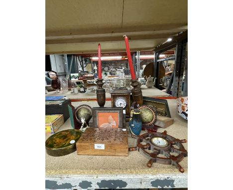 A WOODEN MANTLE CLOCK TOGETHER WITH VARIOUS TREEN WARE TO INCLUDE CANDLESTICKS, A RUSSIAN DOLL, BOOKENDS, SHIPS WHEEL CLOCK E