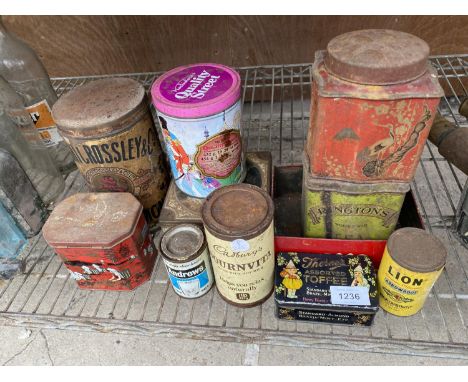 A LARGE ASSORTMENT OF VINTAGE ADVERTISING TINS TO INCLUDE BOURNVILLE AND QUALITY STREETS ETC 