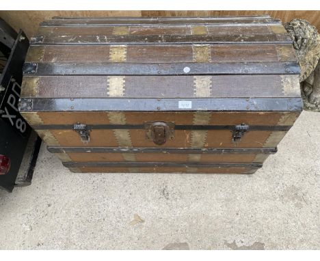 A VINTAGE WOODEN BANDED DOME TOPPED TRAVEL TRUNK 