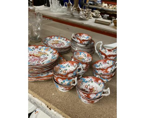 AN ORIENTAL STYLE TEASET TO INCLUDE CUPS, SAUCERS, MILK JUG, SIDE AND SALAD PLATES, CAKE 