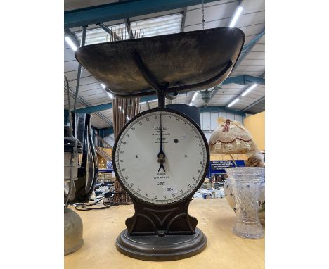 A VINTAGE SSET OF SALTER TRADE SPRING BALANCE SCALES, NUMBER 50T, TO WEIGH 28LB, WITH ENAMELLED FACE AND ARTS AND CRAFTS STYL