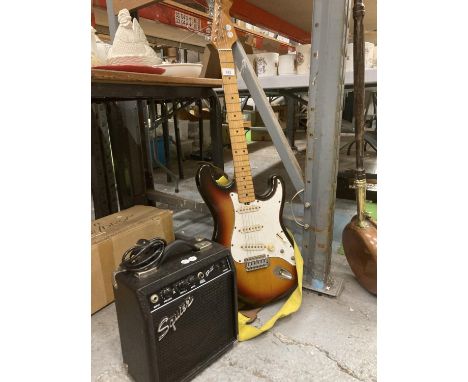 A VINTAGE ELECTRIC GUITAR PLUS A SQUIER AMPLIFIER 