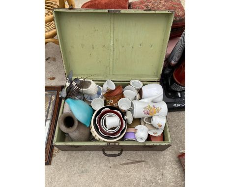 A WOODEN TRAVEL TRUNK CONTAINING AN ASSORTMENT OF CERAMIC ITEMS TO INCLUDE PLANTERS AND CUPS ETC 
