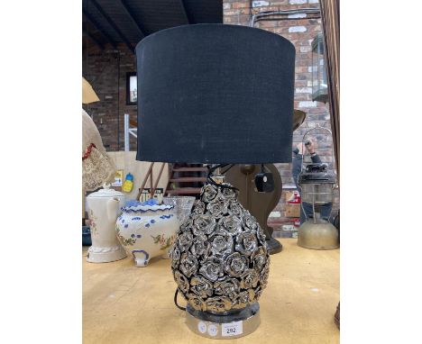 A MODERN WHITE METAL TABLE LAMP WITH 'ROSES' AND A BLACK SHADE 