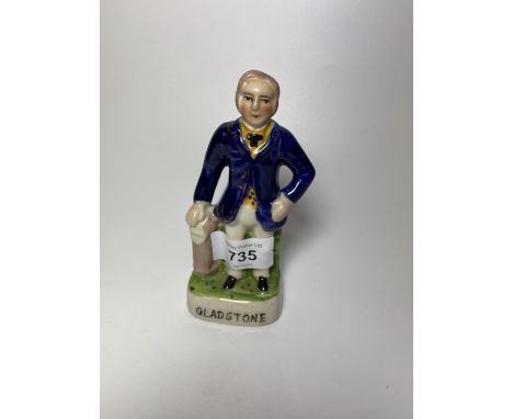 A SMALL STAFFORDSHIRE 'GLADSTONE' CERAMIC FIGURE 