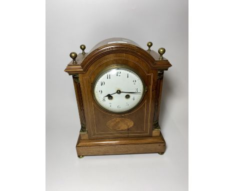 A 19TH CENTURY FRENCH INLAID MAHOGANY BRACKET / MANTLE CLOCK WITH COLUMN SUPPORTS AND BRASS FINIALS, SIGNED 'MARTI' MEDAILLE 