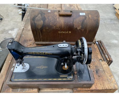 A CASED VINTAGE SINGER SEWING MACHINE 