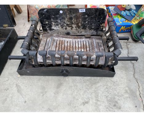 A DECORATIVE CAST IRON FIRE GRATE 