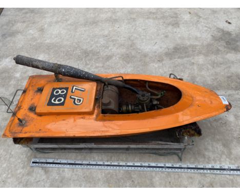 A VINTAGE FIBREGLASS BOAT WITH PETROL ENGINE AND MOTOR BEARING THE STAMP 'LP 89' 