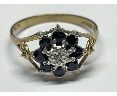 A 9 CARAT GOLD RING WITH DIAMONDS AND SAPPHIRES SIZE N/O 