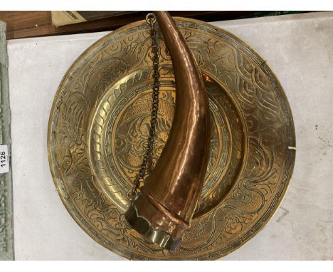 A CHINESE BRASS PLAQUE AND A SHOT FLASK 