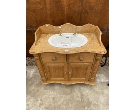 A MODERN PINE WASHSTAND WITH CERAMIC BASIN AND BRASS TAPS, 35" WIDE 