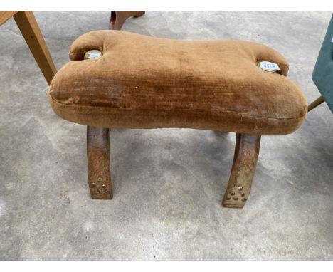 A MIDDLE EASTERN CAMEL FOOT STOOL WITH UPHOLSTERED SEAT 