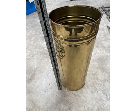 A VINTAGE BRASS STICK STAND WITH LION HEAD HANDLES 