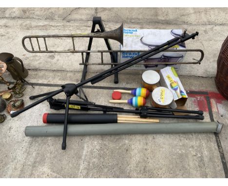 AN ASSORTMENT OF ITEMS TO INCLUDE A TRUMPET, MUSIC STANDS AND A BONGO SET ETC 