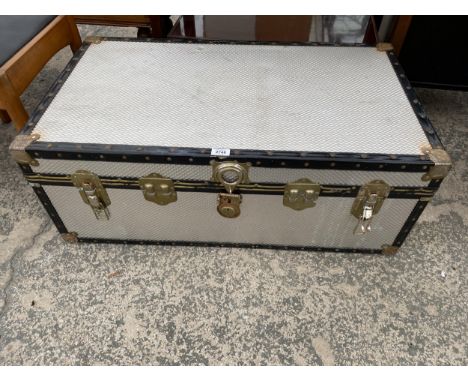 A POLISHED METALWARE TRAVELLING TRUNK, 36 X 20" 