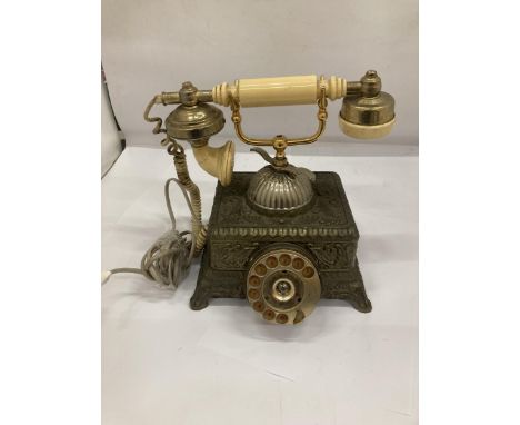 A HEAVY VINTAGE BRASS ORNATE TELEPHONE 