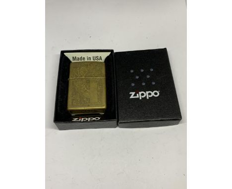 A BRASS ZIPPO LIGHTER IN ORIGINAL PRESENTATION BOX 